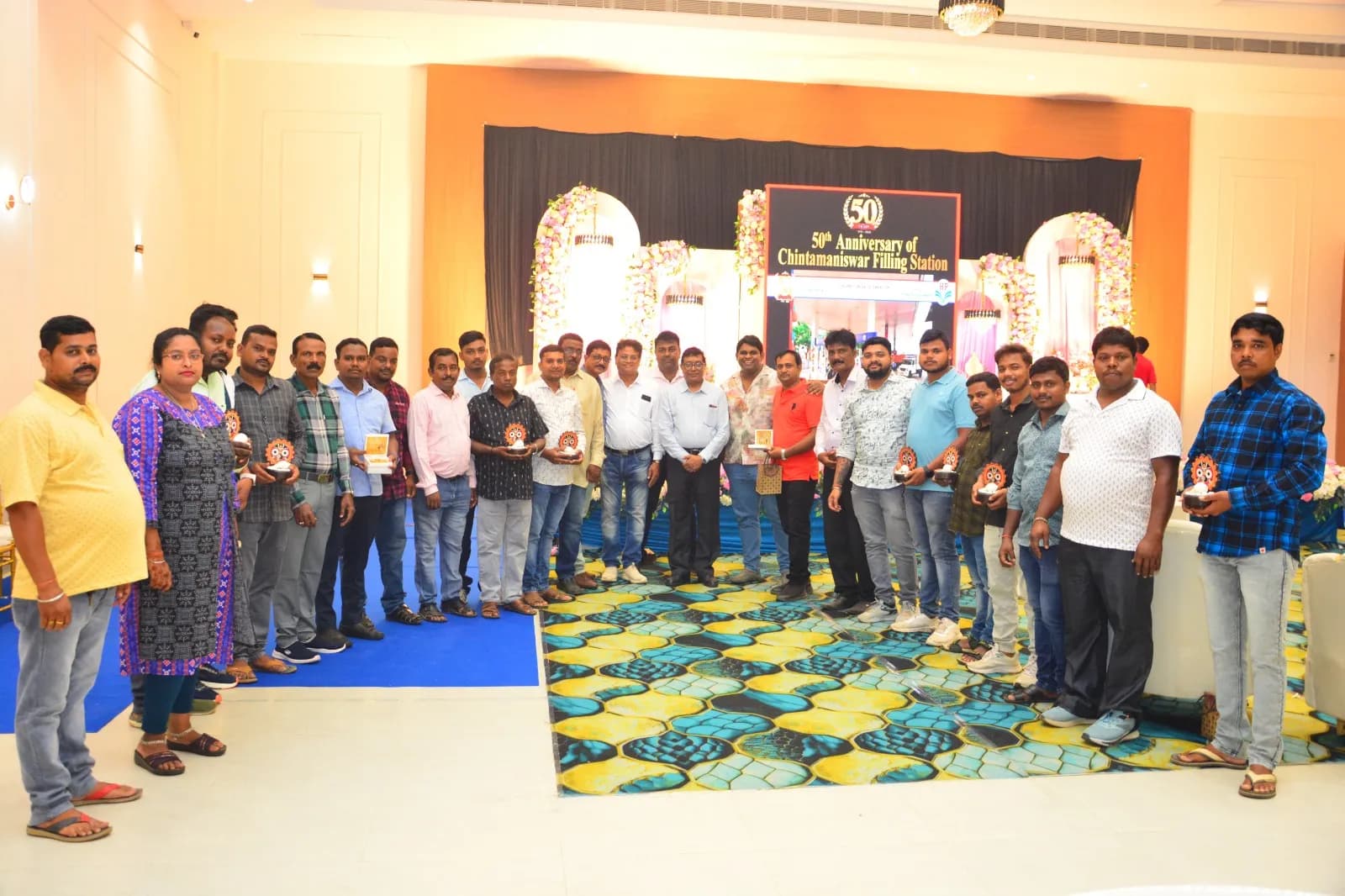 Group photo with staff at the 50th Anniversary celebration of Chintamaniswar Filling Station